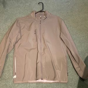 Quality windbreaker w/o hood. Zipper pockets.